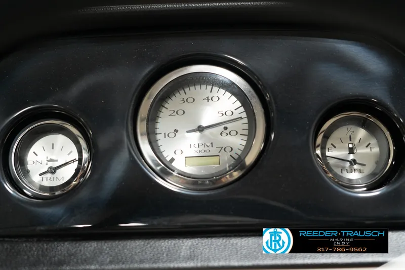 Slide: The Image of Dashboard gauges of 2025 Bennington 21 SLSE boat, featuring RPM, trim, and fuel indicators. - 30