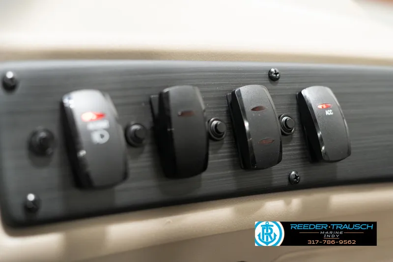 Slide: The Image of Close-up of 2025 Bennington 21 SLSE boat control panel switches. - 31
