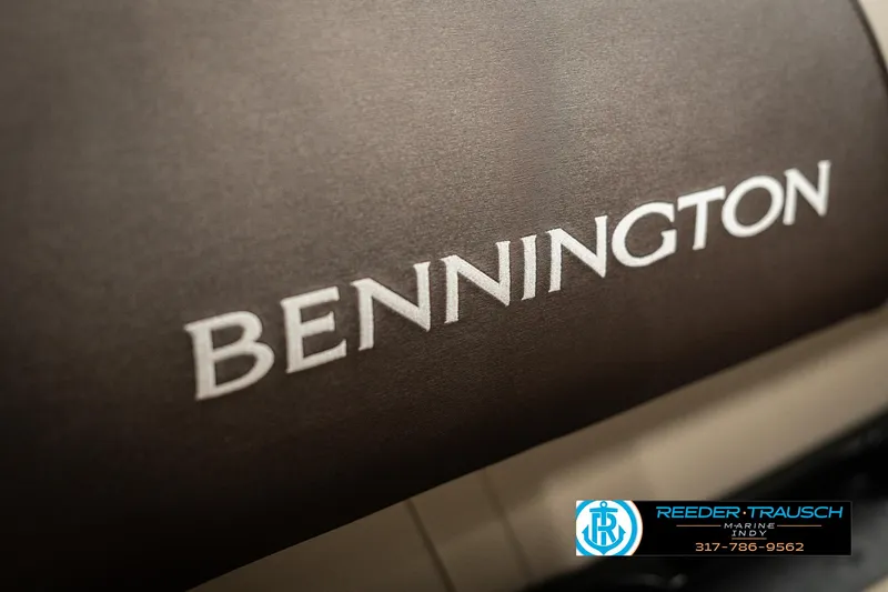 Slide: The Image of 2025 Bennington 21 SLSE boat logo on seat cover, Reeder-Trausch Marine branding. - 38