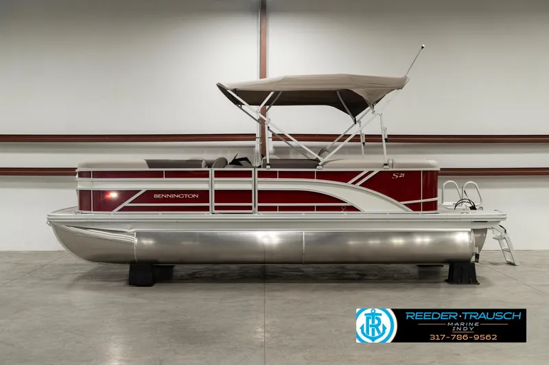 Slide: The Image of 2025 Bennington 21 SLSE pontoon boat with canopy in showroom. - 4
