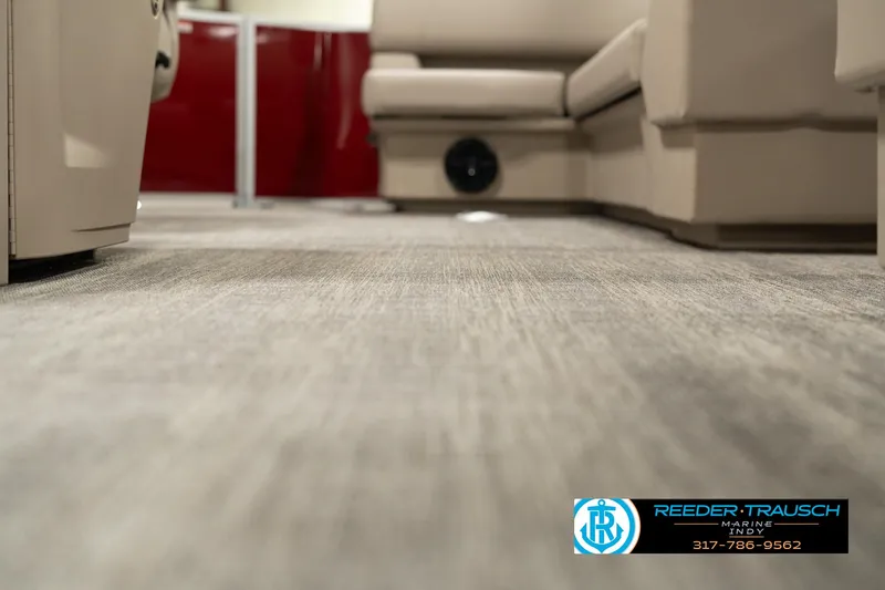 Slide: The Image of Interior view of 2025 Bennington 21 SLSE pontoon boat with carpet flooring. - 40