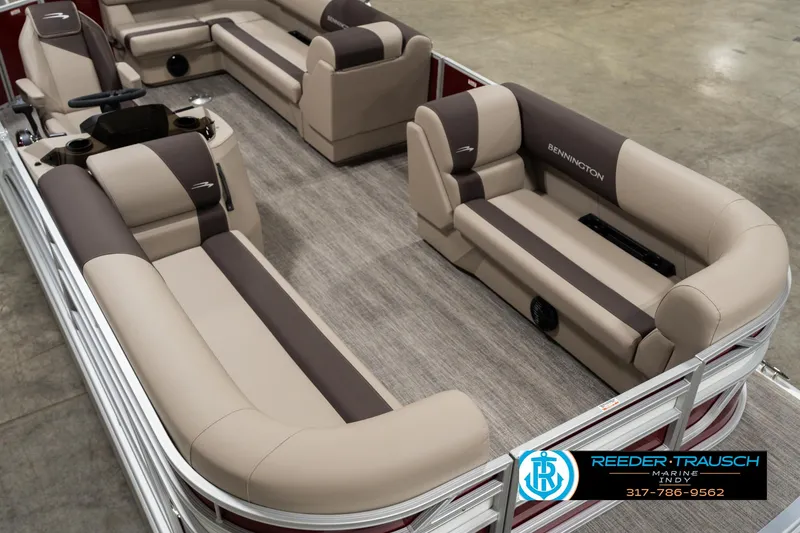 Slide: The Image of 2025 Bennington 21 SLSE pontoon boat interior with beige and brown seating. - 8