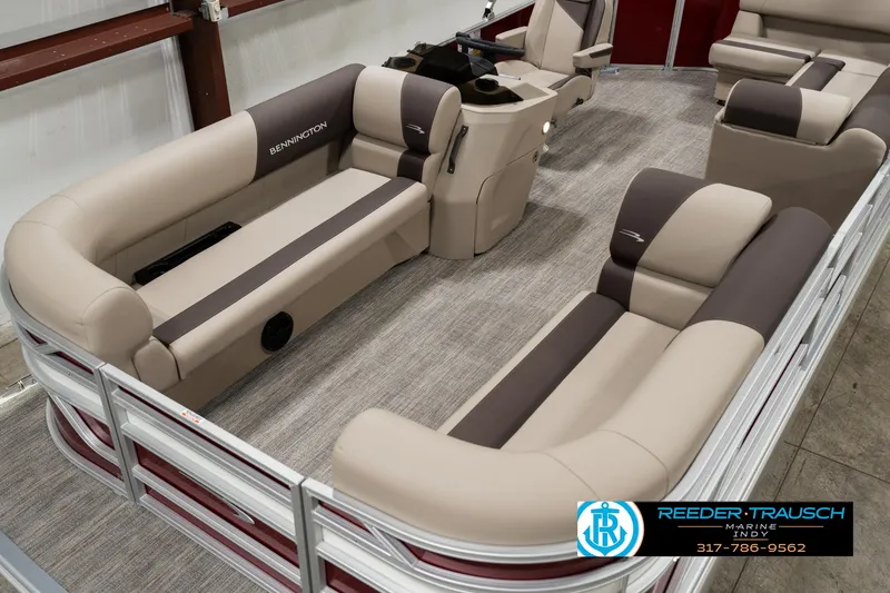Slide: The Image of 2025 Bennington 21 SLSE pontoon boat interior with beige and brown seating. - 9