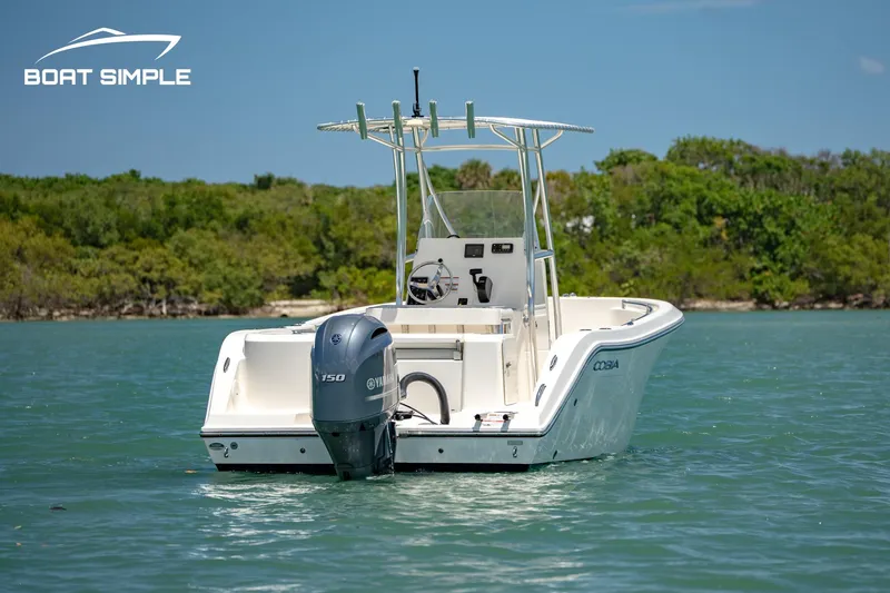 Slide: The Image of 2021 Cobia 201 Center Console boat on water, featuring Yamaha outboard motor. - 3
