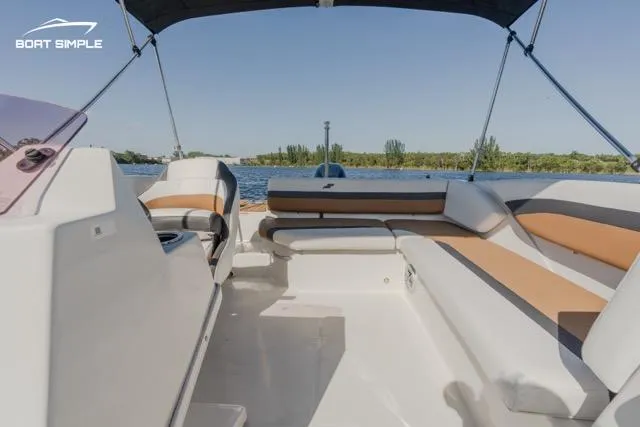 Slide: The Image of 2022 Starcraft SVX 171 OB boat interior with seating, canopy, and water view. - 6