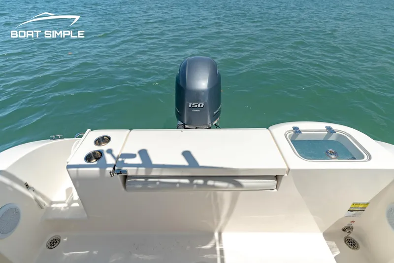 Slide: The Image of 2021 Cobia 201 Center Console boat with Yamaha 150 engine on water. - 9