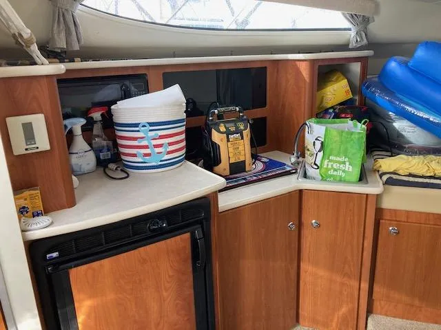 Slide: The Image of Interior of 2004 Bayliner 3055 Ciera with storage and supplies. - 10
