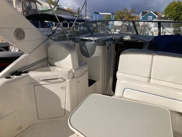 Slide: The Image of 2004 Bayliner 3055 Ciera boat interior with seating and table. - 4