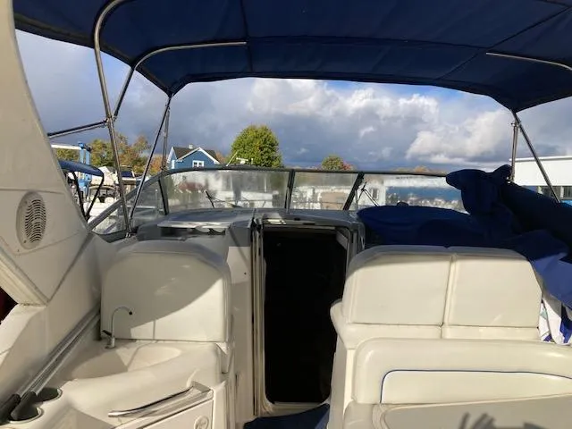 Slide: The Image of 2004 Bayliner 3055 Ciera boat interior with blue canopy and seating. - 5