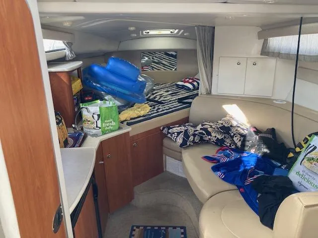 Slide: The Image of Interior of 2004 Bayliner 3055 Ciera boat with seating and storage. - 6