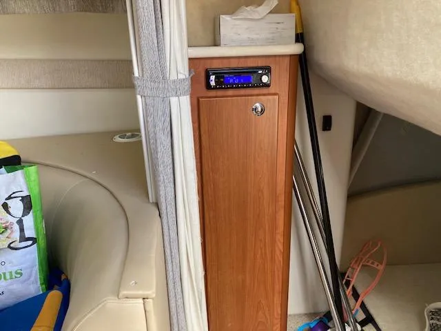 Slide: The Image of Interior of 2004 Bayliner 3055 Ciera boat with seating and storage cabinet. - 8