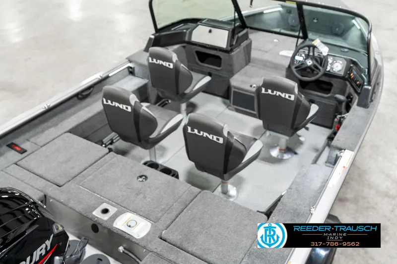 Slide: The Image of 2025 Lund 1775 Impact XS boat interior with four seats and steering console. - 10
