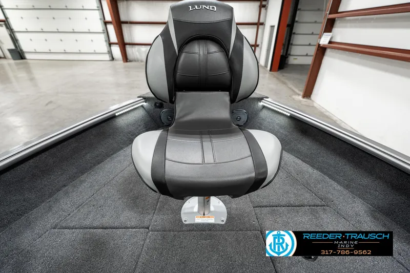 Slide: The Image of 2025 Lund 1775 Impact XS boat seat in a showroom setting. - 20