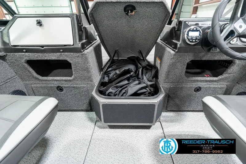 Slide: The Image of 2025 Lund 1775 Impact XS boat interior with open storage compartment. - 22