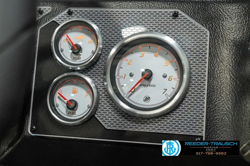 Slide: The Image of 2025 Lund 1775 Impact XS dashboard with trim and fuel gauges. - 33