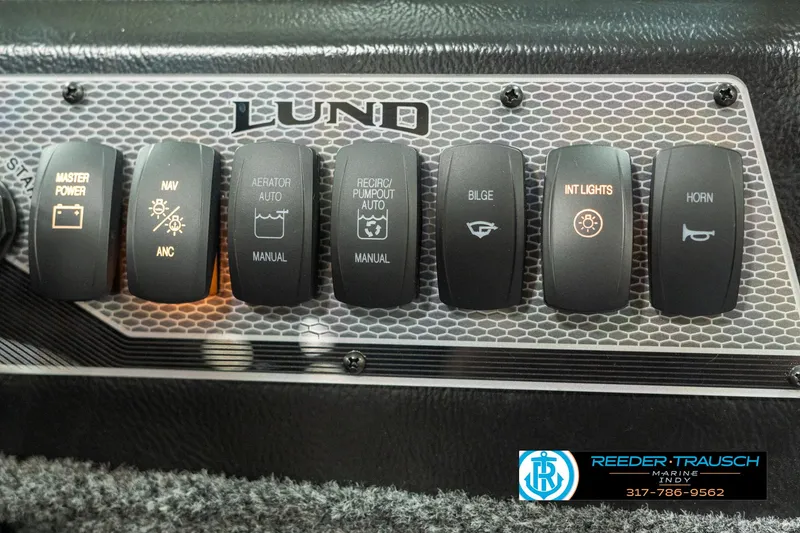 Slide: The Image of Control panel of 2025 Lund 1775 Impact XS boat with various switches. - 34