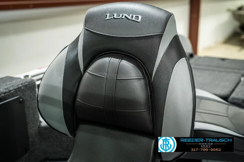 Slide: The Image of 2025 Lund 1775 Impact XS boat seat, black and gray design, Reeder-Trausch logo visible. - 35