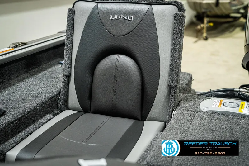 Slide: The Image of 2025 Lund 1775 Impact XS boat seat, gray and black upholstery, Reeder-Trausch logo visible. - 37