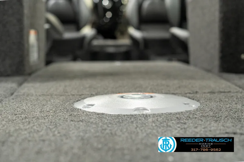 Slide: The Image of 2025 Lund 1775 Impact XS boat interior with carpeted flooring and seating. - 42