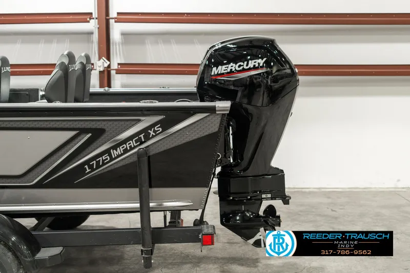 Slide: The Image of 2025 Lund 1775 Impact XS boat with Mercury outboard motor in showroom. - 44