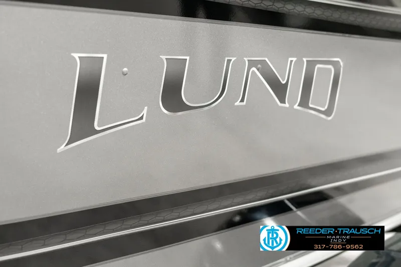 Slide: The Image of 2025 Lund 1775 Impact XS boat logo with dealership contact information. - 46