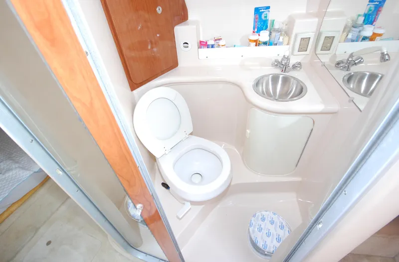 Slide: The Image of 2007 Regal 2665 Commodore bathroom with toilet, sink, and toiletries. - 15