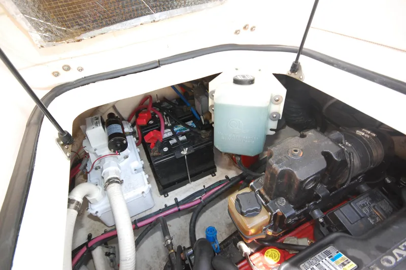 Slide: The Image of Engine compartment of a 2007 Regal 2665 Commodore boat, showing battery and components. - 20