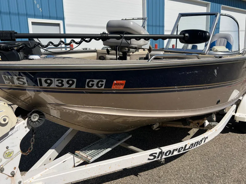 Slide: The Image of 2001 Alumacraft Trophy 175 boat on ShoreLand'r trailer, parked outdoors. - 21