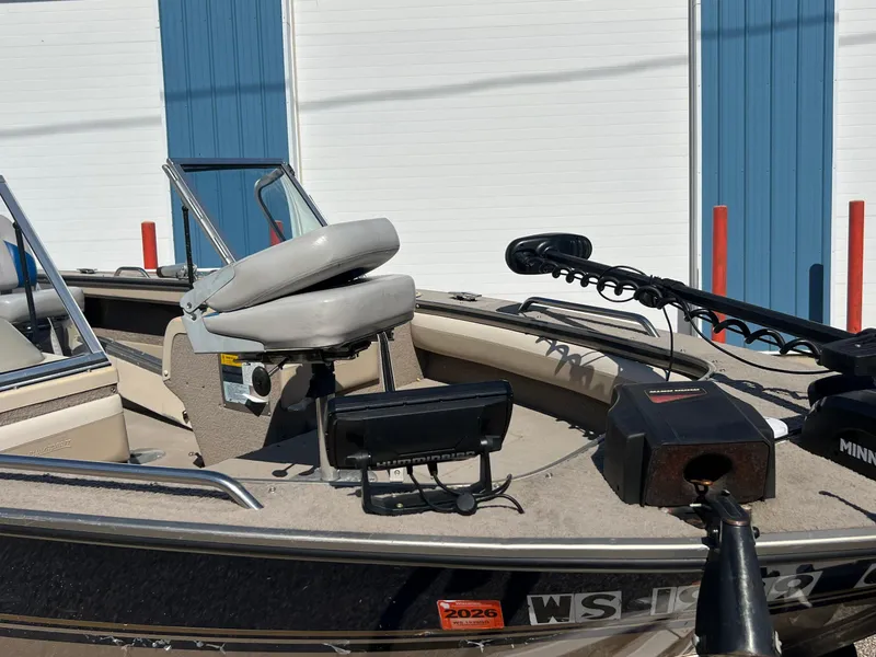 Slide: The Image of 2001 Alumacraft Trophy 175 boat with seating and fishing equipment. - 4