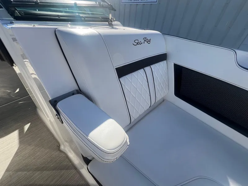 Slide: The Image of 2018 Sea Ray 280 SLX boat interior with white leather seating and armrest. - 15