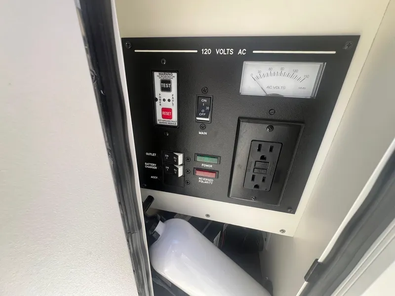 Slide: The Image of Electrical panel of 2018 Sea Ray 280 SLX boat with 120 volts AC outlet. - 16