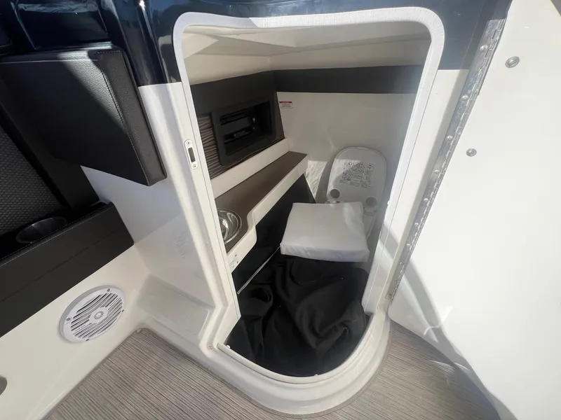 Slide: The Image of Interior cabin of 2018 Sea Ray 280 SLX boat with compact amenities. - 19