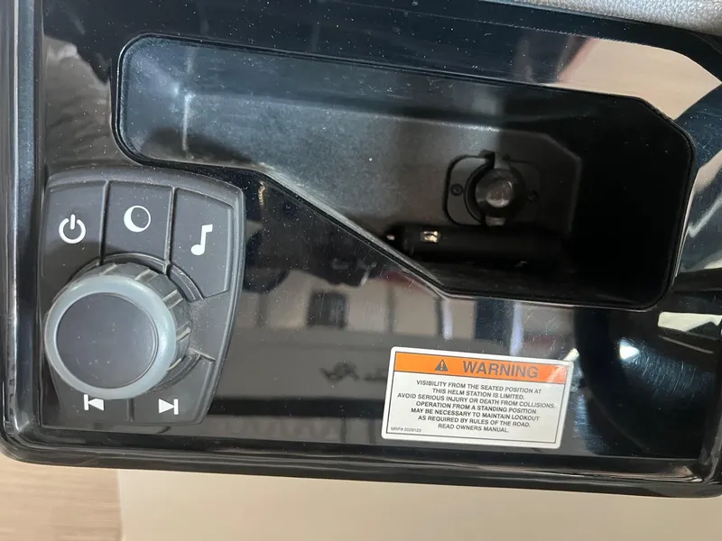 Slide: The Image of Control panel of a 2018 Sea Ray 280 SLX boat with warning label. - 23