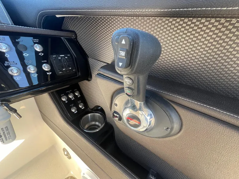 Slide: The Image of 2018 Sea Ray 280 SLX boat control panel with throttle and trim buttons. - 24