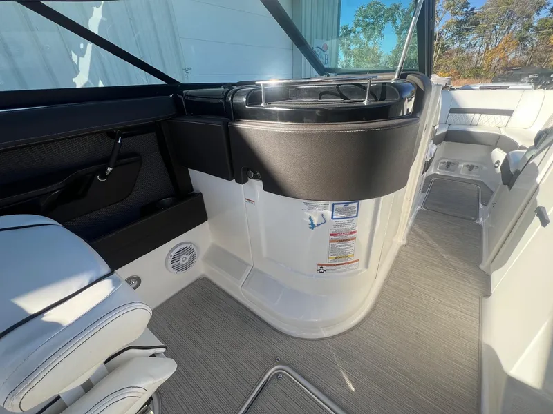 Slide: The Image of Interior of 2018 Sea Ray 280 SLX boat, featuring seating and control panel. - 28