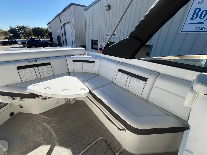 Slide: The Image of 2018 Sea Ray 280 SLX boat interior with white seating and table. - 30