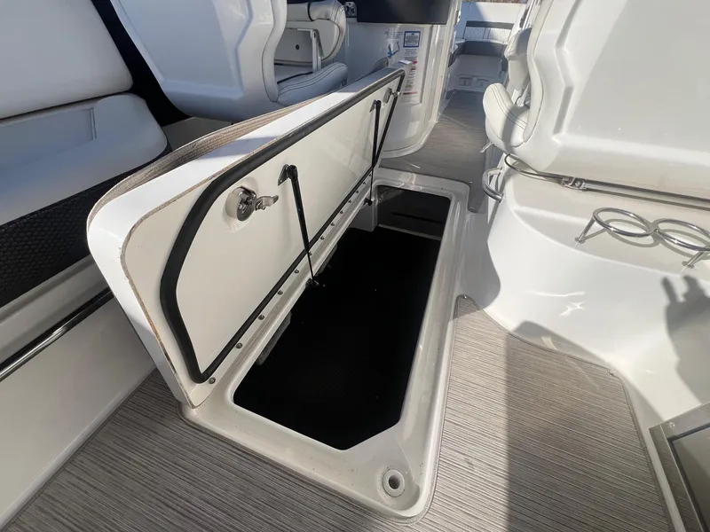 Slide: The Image of Open storage compartment on 2018 Sea Ray 280 SLX boat interior. - 32