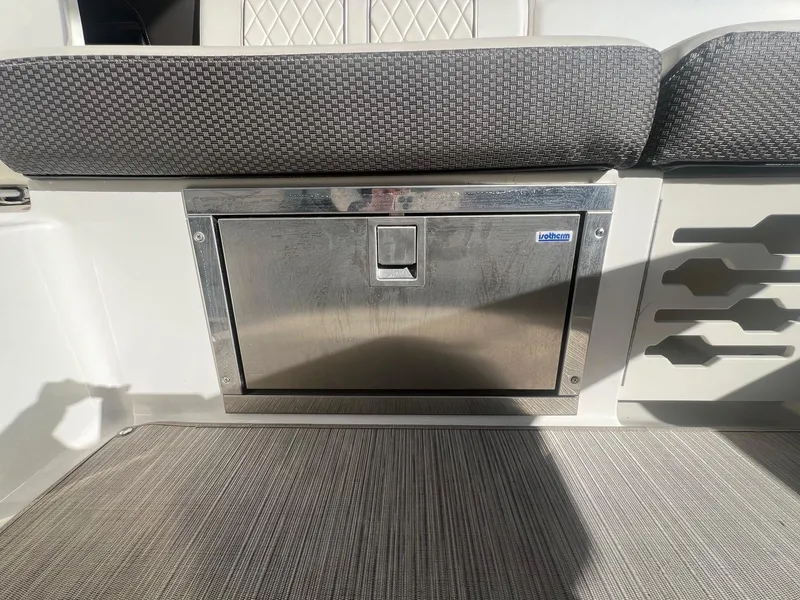 Slide: The Image of 2018 Sea Ray 280 SLX boat interior with stainless steel storage compartment. - 34