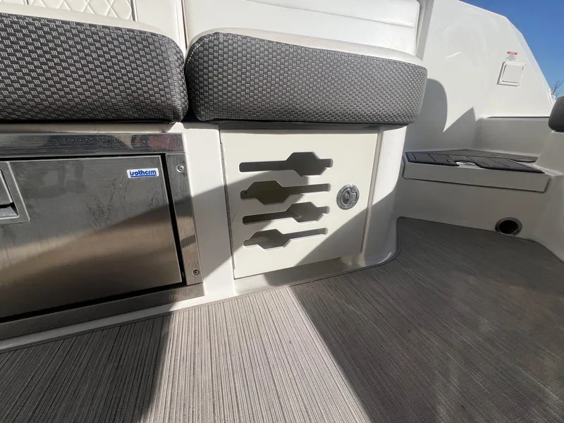Slide: The Image of 2018 Sea Ray 280 SLX interior with seating and storage compartments. - 35