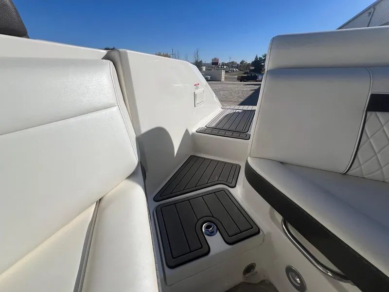 Slide: The Image of Interior seating of 2018 Sea Ray 280 SLX boat, featuring white upholstery and black accents. - 36