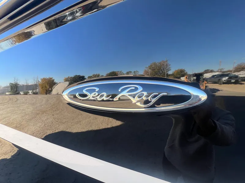 Slide: The Image of Close-up of 2018 Sea Ray 280 SLX logo on a shiny boat surface. - 5