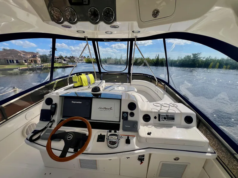 Slide: The Image of 2007 Sea Ray 52 Sedan Bridge helm with panoramic water view. - 21