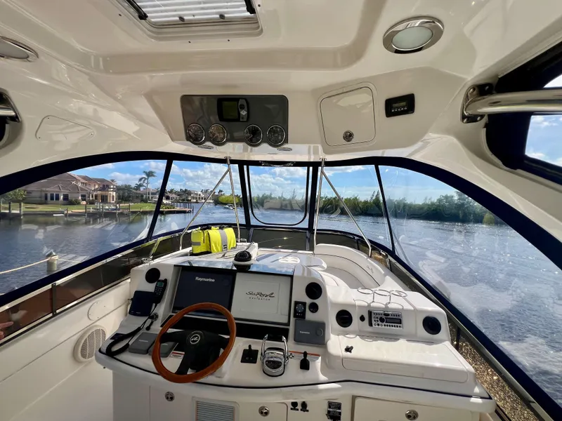 Slide: The Image of 2007 Sea Ray 52 Sedan Bridge helm with scenic waterway view. - 23