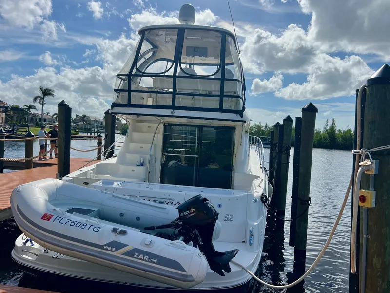 Slide: The Image of 2007 Sea Ray 52 Sedan Bridge yacht docked with inflatable boat. - 3