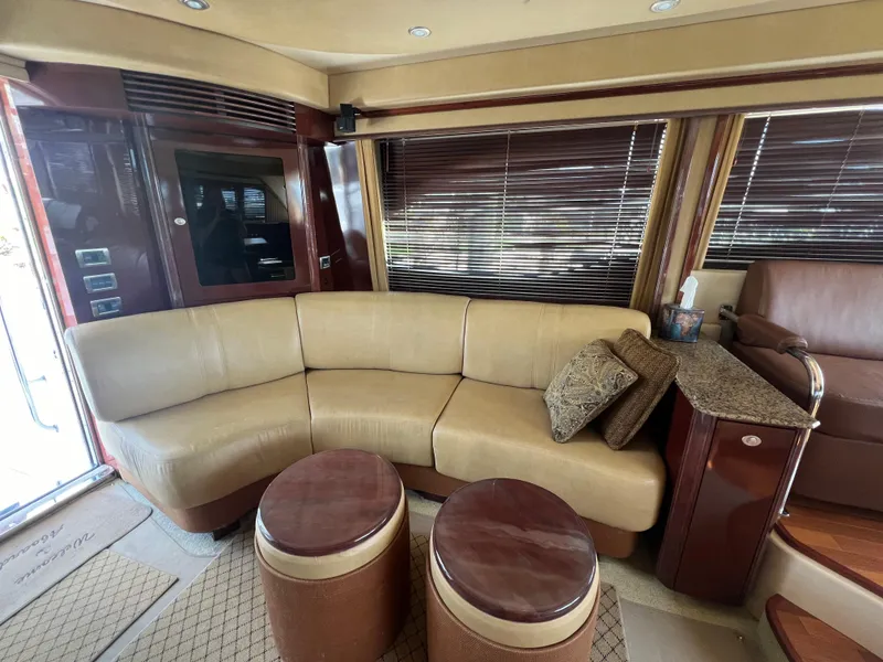 Slide: The Image of Luxurious interior of 2007 Sea Ray 52 Sedan Bridge yacht with beige leather seating. - 31