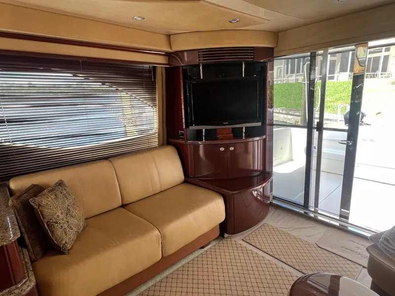 Slide: The Image of Luxurious interior of 2007 Sea Ray 52 Sedan Bridge yacht with sofa and TV. - 33