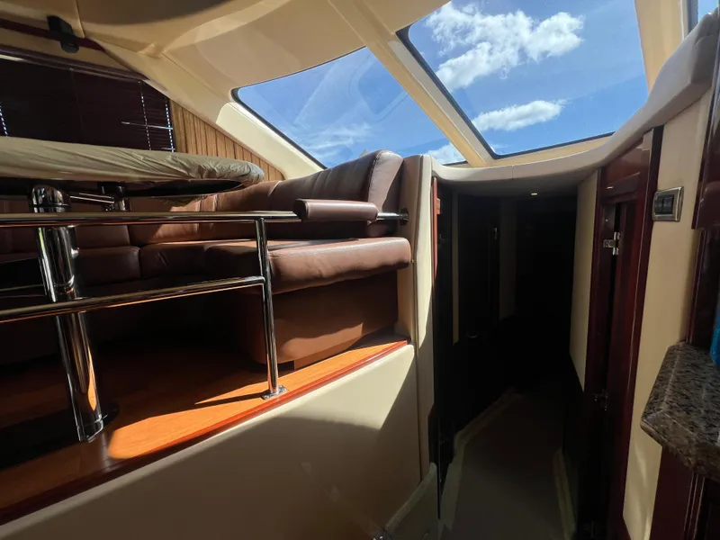 Slide: The Image of Interior of 2007 Sea Ray 52 Sedan Bridge with skylight and leather seating. - 37