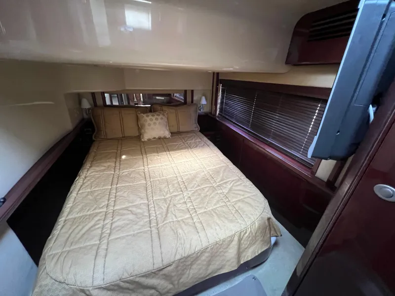 Slide: The Image of Luxurious bedroom interior of 2007 Sea Ray 52 Sedan Bridge yacht. - 43