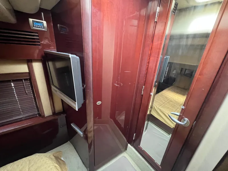 Slide: The Image of Luxurious interior of 2007 Sea Ray 52 Sedan Bridge yacht with wood finishes. - 44