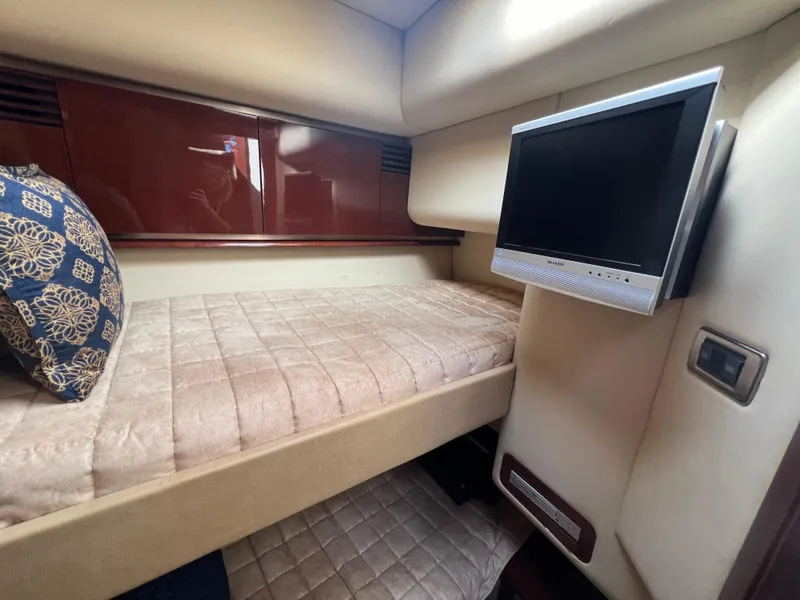 Slide: The Image of Interior cabin of 2007 Sea Ray 52 Sedan Bridge with bed and wall-mounted TV. - 46